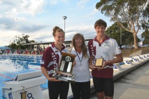 Traralgon Captains Erin Roberts and Caiden Gill with Ken and Pat Hewat Trophy as Gippsland Champion Club.  Presented by GSI President Jackie Madden